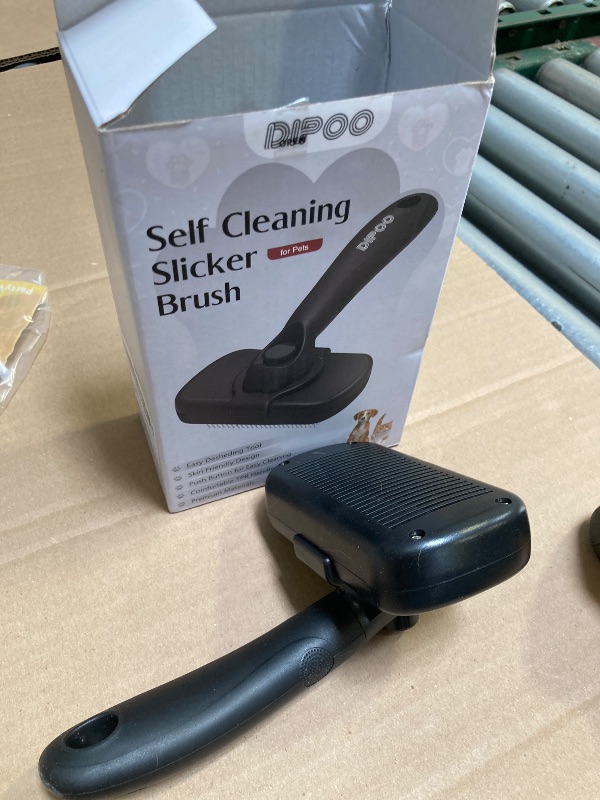 Photo 1 of Dipoo Self Cleaning Shedding Brush - Skin Friendly Grooming Tool for Dogs, Cats, and Puppies, Deshedding and Hair Removal for Long and Short Haired Pets, Black