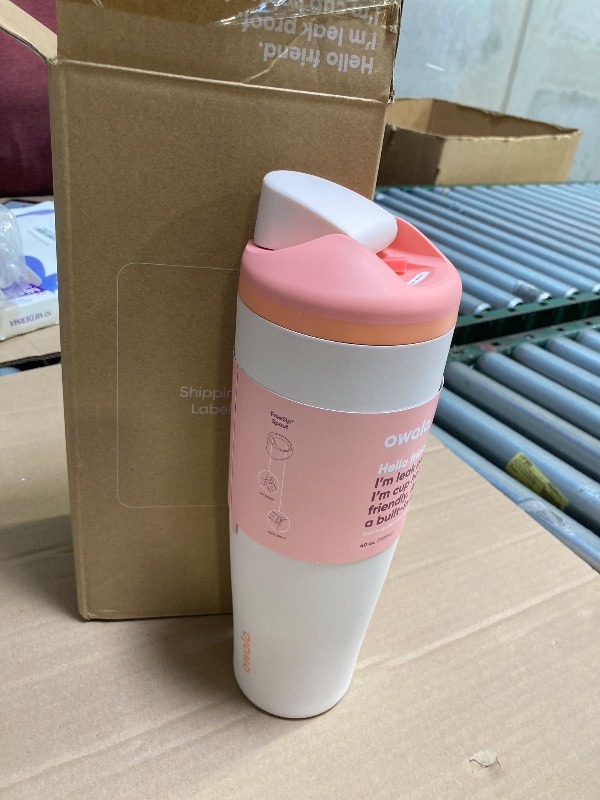 Photo 1 of Owala FreeSip Tumbler Insulated Stainless Steel Water Bottle with Built-in Straw and Side Handle, For Travel, Work, School, and Sports, 40oz, BPA Free, Leak Proof, Orange/Tan (Sparkling Sherbet)