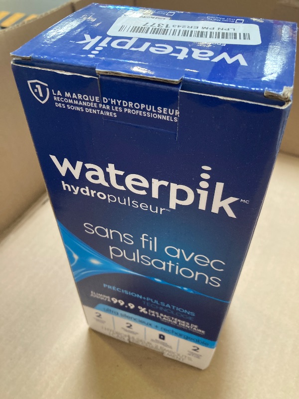 Photo 1 of Waterpik Cordless Pulse Rechargeable Portable Water Flosser for Teeth, Gums, Braces Care and Travel with 2 Flossing Tips, Waterproof, ADA Accepted, WF-20 White, Packaging May Vary