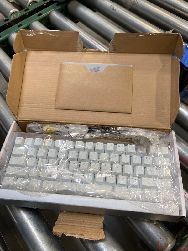 Photo 1 of Razer Huntsman Mini 60% Gaming Keyboard: Fast Keyboard Switches - Clicky Optical Switches - Chroma RGB Lighting - PBT Keycaps - Onboard Memory - Snap Tap - White