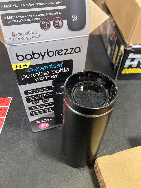 Photo 1 of Baby Brezza SuperFast Portable Baby Bottle Warmer – 67% Faster - Travel Breastmilk Warmer and Formula Warmer - Safe, Even Heating - Up to 9oz - No Adapters, Black
