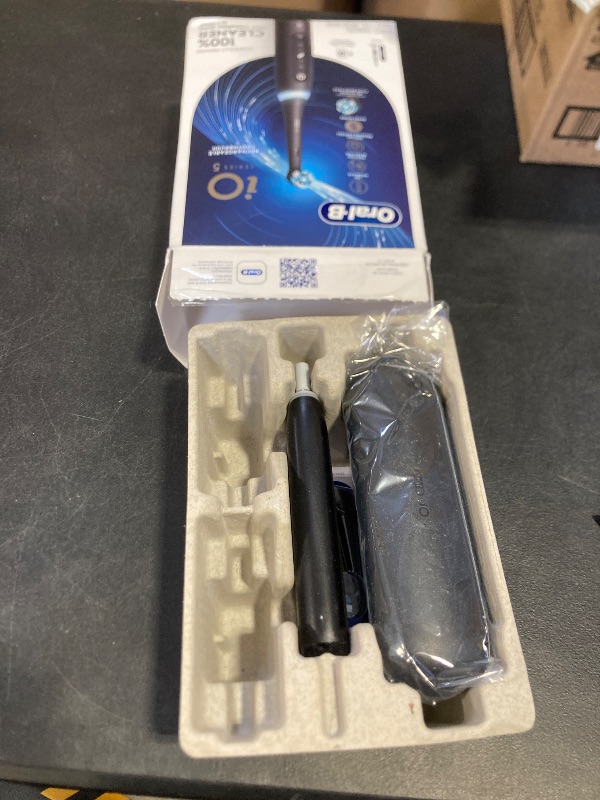 Photo 1 of Oral-B iO Series 5 Rechargeable Electric Toothbrush with Visible Pressure Sensor to Protect Gums, 2 Minute Timer, 5 Cleaning Settings, 1 Replacement Toothbrush Heads, and Travel Case, Black