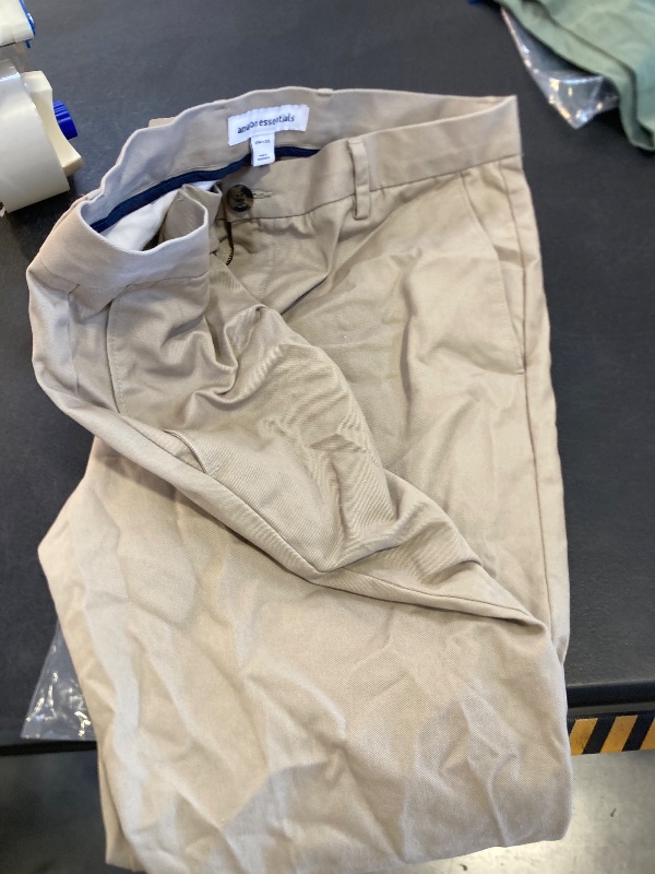 Photo 1 of Amazon Essentials Men's Slim-Fit Wrinkle-Resistant Flat-Front Stretch Chino Pant, Tan, 33W x 32L