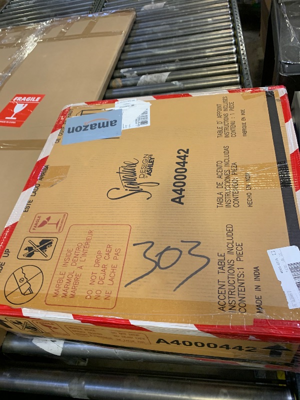 Photo 1 of Signature Design by Ashley Ryandale | Contemporary Accent Table – Glass Top, Aluminum Frame & Marble Shelf, Antique Brass Finish