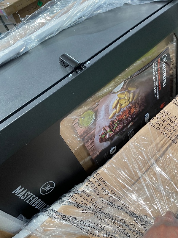 Photo 1 of (minor damage) Masterbuilt® 30-inch Digital Electric Vertical BBQ Smoker with Leg Kit, Side Wood Chip Loader and 710 Cooking Square Inches in Black, Model MB20070421