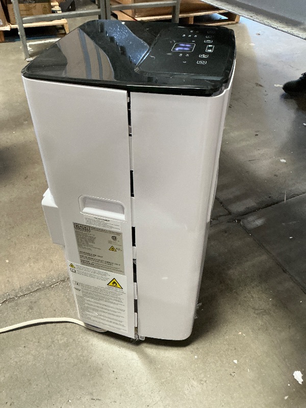 Photo 1 of ** unit is cracked on both sides, powers on*** BLACK+DECKER 8,000 BTU Portable Air Conditioner with Wifi & Remote Control, 3-1-in AC, Fan & Dehumidifier, with App, Alexa & Google Assistant, Window Kit