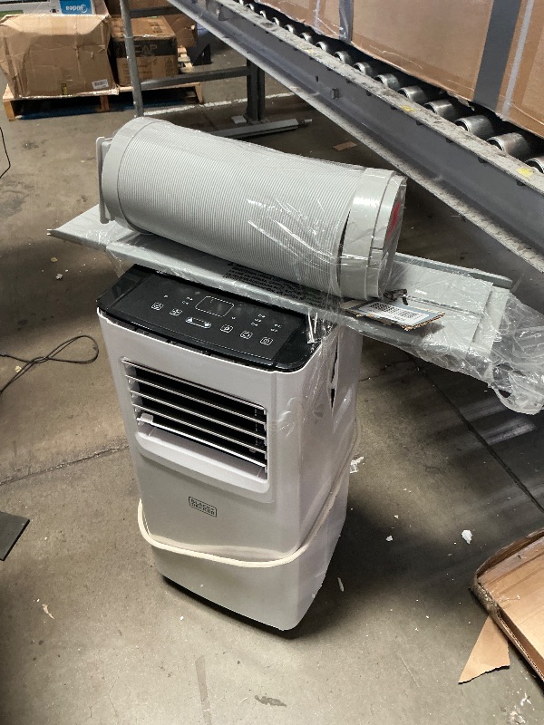 Photo 1 of ** unit is cracked on both sides, powers on*** BLACK+DECKER 8,000 BTU Portable Air Conditioner with Wifi & Remote Control, 3-1-in AC, Fan & Dehumidifier, with App, Alexa & Google Assistant, Window Kit
