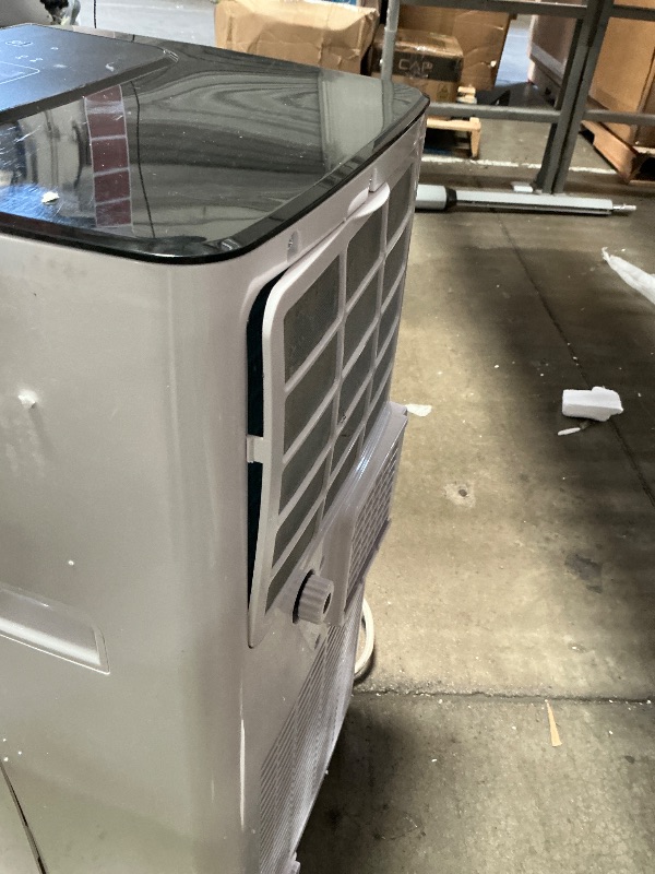 Photo 1 of ** unit is cracked on both sides, powers on*** BLACK+DECKER 8,000 BTU Portable Air Conditioner with Wifi & Remote Control, 3-1-in AC, Fan & Dehumidifier, with App, Alexa & Google Assistant, Window Kit
