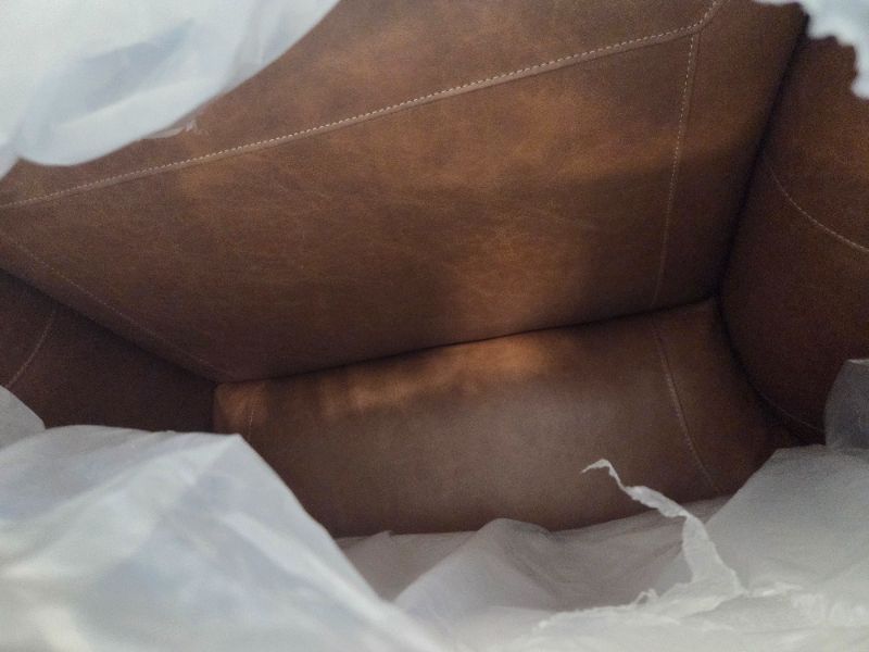 Photo 1 of *** BRING BIG TRUCK ITEM IS XL ON PALLET** Signature Design by Ashley Carianna Traditional Firmly Cushioned Leather Rectangular Ottoman with Decorative Turn Legs, Brown