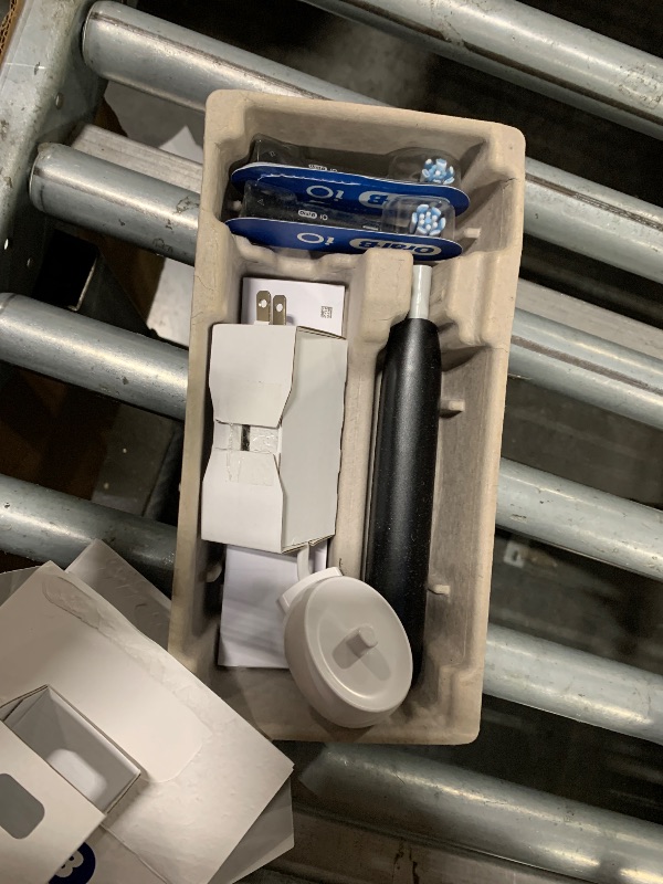 Photo 1 of **UNTESTED**
Oral-B Rechargeable Electric Toothbrush, iO2 Starter Kit, 3 Cleaning Modes, Automatic Pressure Sensor to Protect Gums, 2 Brush Heads, Night Black