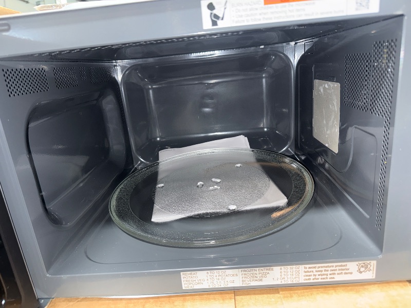 Photo 1 of ***damage minor*** SHARP Countertop Microwave Oven with Removable 13.6" Carousel Turntable, 1100 Watt, 1.6 Cubic Feet, Stainless Steel