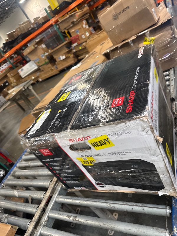 Photo 1 of ***damage minor*** SHARP Countertop Microwave Oven with Removable 13.6" Carousel Turntable, 1100 Watt, 1.6 Cubic Feet, Stainless Steel