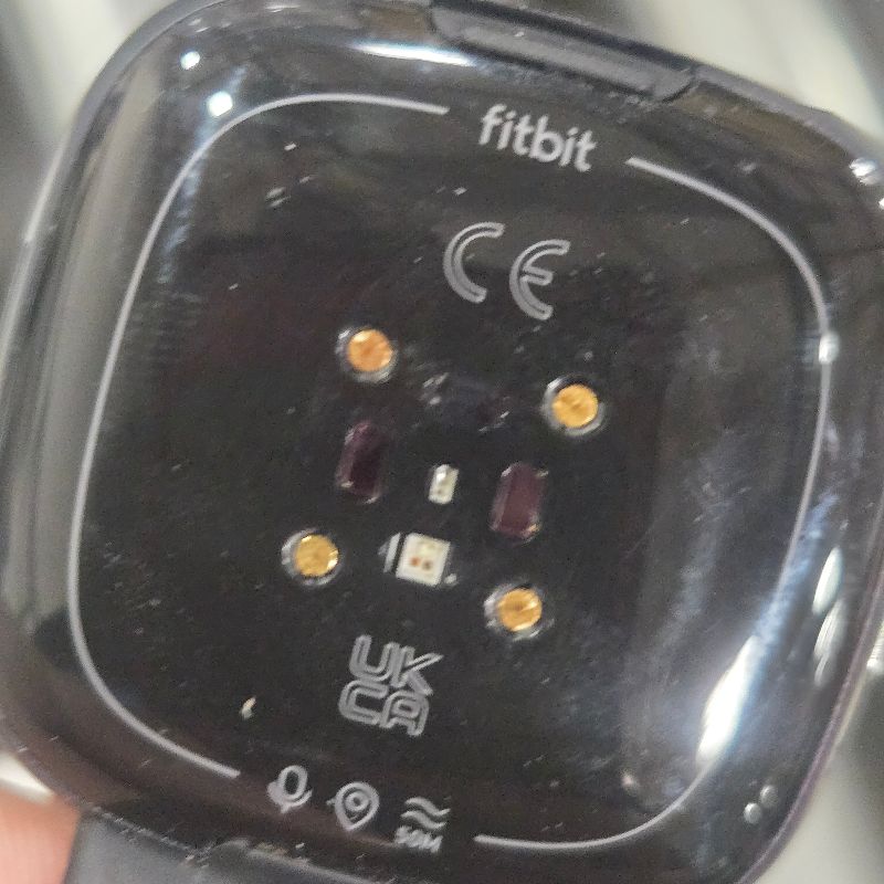 Photo 1 of **NO CHARGER** Fitbit Versa 4 Fitness Smartwatch with Daily Readiness, GPS, 24/7 Heart Rate, 40+ Exercise Modes, Sleep Tracking and more, Black/Graphite, One Size (S & L Bands Included)