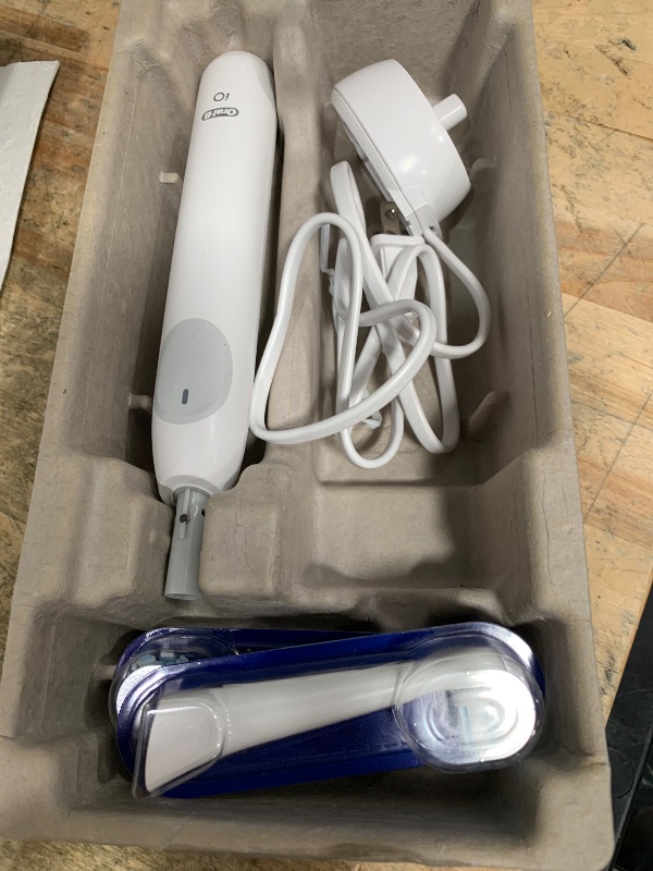 Photo 1 of ***ITEM NOT CHARGING** Oral-B Rechargeable Electric Toothbrush, iO2 Starter Kit, 3 Cleaning Modes, Automatic Pressure Sensor to Protect Gums, 2 Brush Heads, Pure White