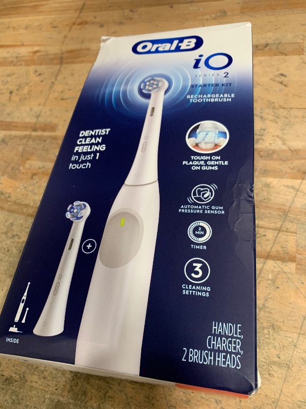 Photo 1 of ***ITEM NOT CHARGING** Oral-B Rechargeable Electric Toothbrush, iO2 Starter Kit, 3 Cleaning Modes, Automatic Pressure Sensor to Protect Gums, 2 Brush Heads, Pure White