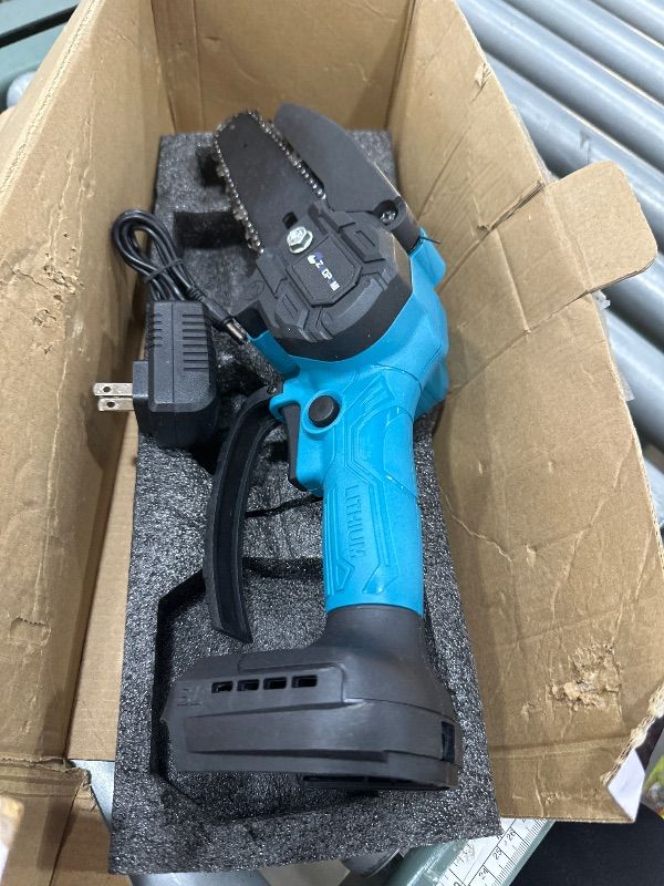 Photo 1 of **PARTS ONLY** **NONFUNCTIONAL** 6 Inch Cordless Electric Mini Chainsaw, Handheld Battery Powered Pruning Saw, branch cutter, Yard Work Garden Tool (One Battery&Chain)