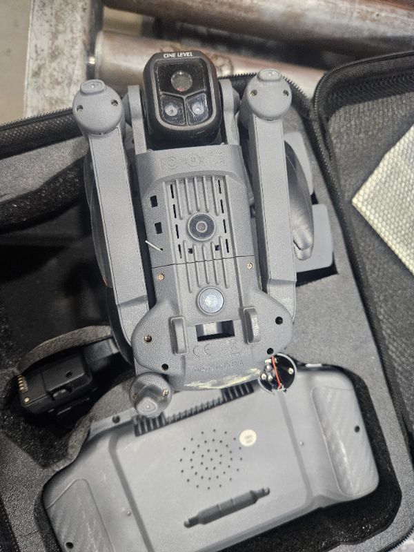 Photo 1 of **PARTS ONLY** GPS Drone with 8K Camera for Adults, Obstacle Avoidance, 5G Large Screen Controller, Follow Me, 3 Batteries 75 Min Flight Time, 50x Zoom, Brushless Motor, Under 249g (Deep Space Grey) ** the bottom side of a leg is broken see pics **