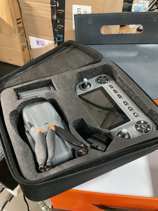 Photo 1 of **PARTS ONLY** GPS Drone with 8K Camera for Adults, Obstacle Avoidance, 5G Large Screen Controller, Follow Me, 3 Batteries 75 Min Flight Time, 50x Zoom, Brushless Motor, Under 249g (Deep Space Grey) ** the bottom side of a leg is broken see pics **