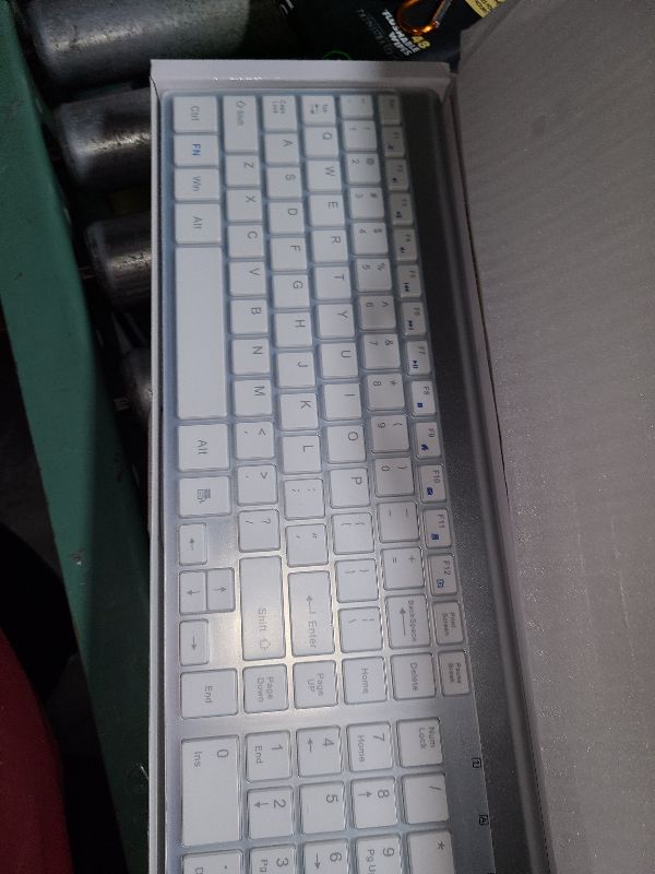 Photo 1 of Wireless Keyboard and Mouse Ultra Slim Combo, TopMate 2.4G Silent Compact USB 2400DPI Mouse and Scissor Switch Keyboard Set with Cover, 2 AA and 2 AAA Batteries, for PC/Laptop/Windows/Mac-Silver White