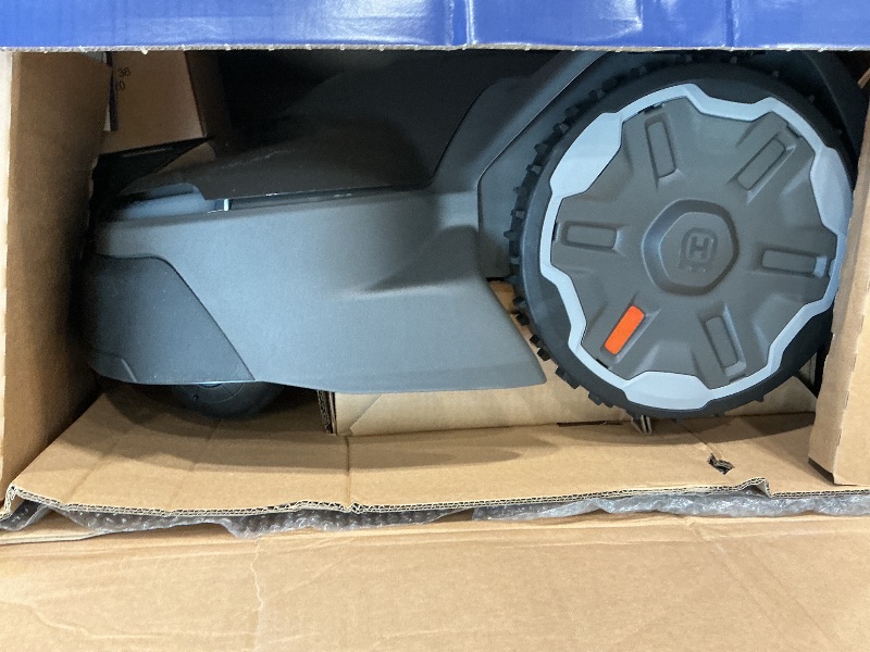 Photo 1 of **UNTESTED & Missing Parts**
Husqvarna 410iQ Automower Robotic Mower, 0.5 Acre Mowing Capacity, Wire Free Robot Lawn Mower with Charging Station, RS1 EPOS Reference Station and Replacement Blades, 970727401