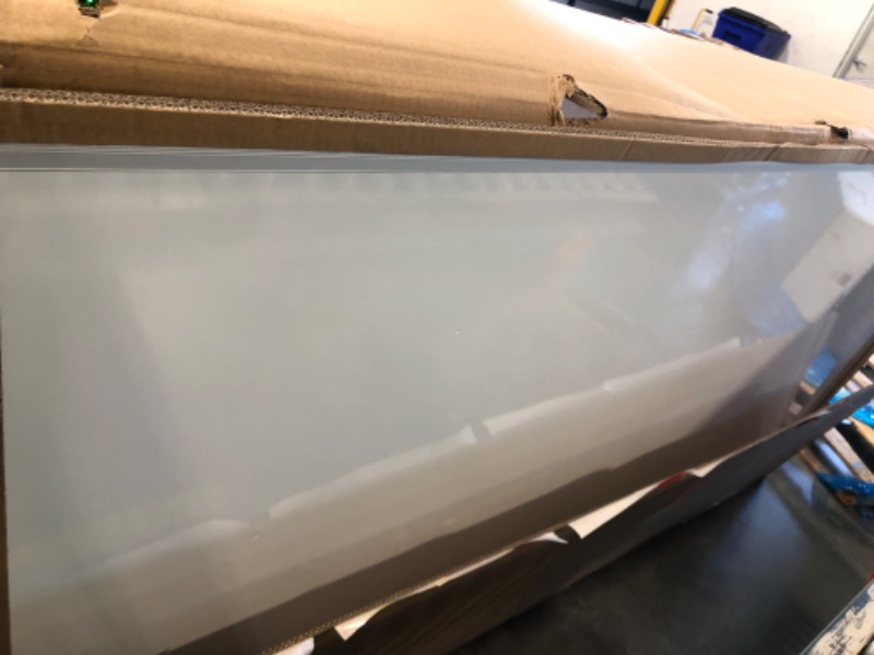 Photo 1 of **minor damage**95 in white board by 50 in 