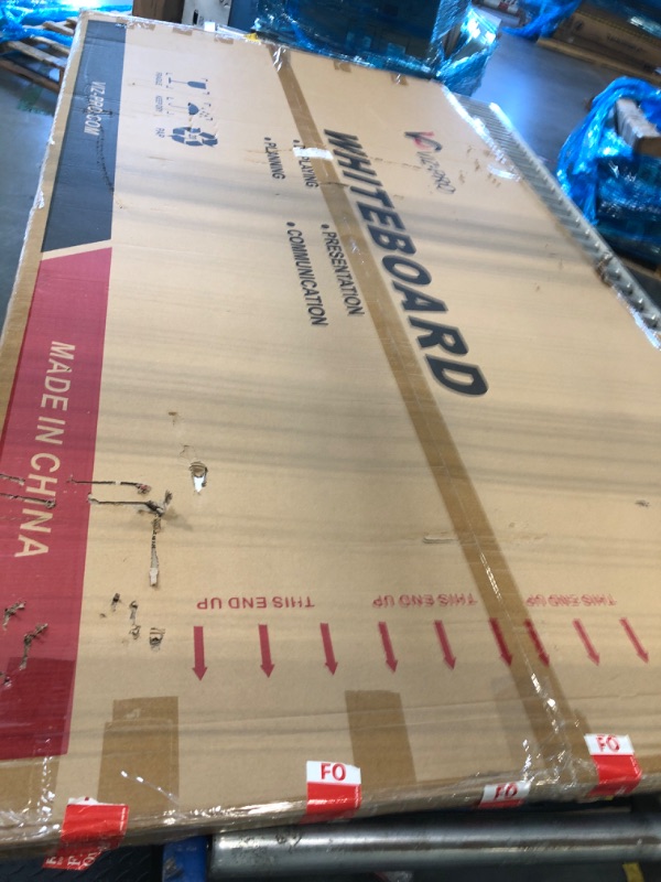 Photo 1 of **minor damage**95 in white board by 50 in 