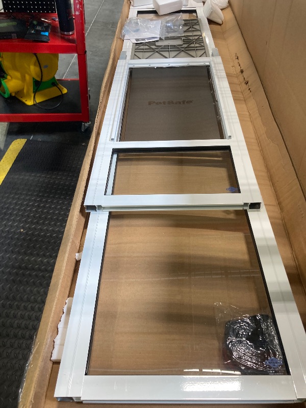 Photo 1 of ****POSSIBLE MISSING PARTS*** PetSafe Sliding Glass Pet Door - No-Cut DIY Install Doggy Door for Renters - Aluminum Frame - Adjustable Height 91 7/16" to 96" - Ideal for Large Dogs Up to 130 lb - White