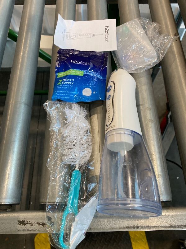 Photo 1 of *Minor Damaged* H2ofloss Water Dental Flosser Portable Dental Oral Irrigator with 5 Modes, 6 Replaceable Jet Tips, Rechargeable IPX7 Waterproof Teeth Cleaner for Home and Travel -300ml Detachable Reservoir (HF-6)