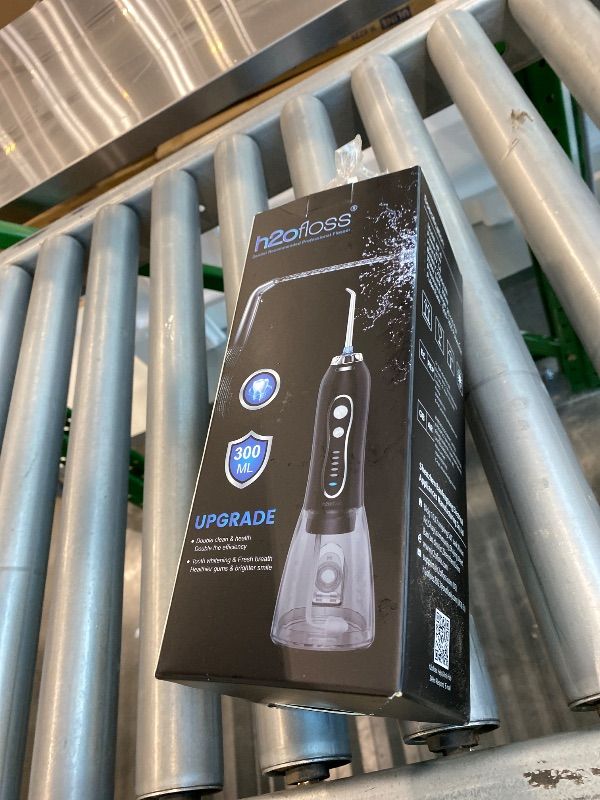 Photo 1 of *Minor Damaged* H2ofloss Water Dental Flosser Portable Dental Oral Irrigator with 5 Modes, 6 Replaceable Jet Tips, Rechargeable IPX7 Waterproof Teeth Cleaner for Home and Travel -300ml Detachable Reservoir (HF-6)