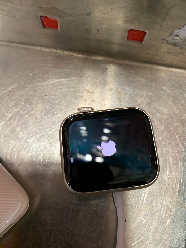 Photo 1 of  Apple Watch SE (2nd Gen) [GPS 40mm] Smartwatch with Starlight Aluminum Case with Starlight Sport Band S/M. Fitness and Sleep Trackers, Crash Detection, Heart Rate Monitor, Retina Display
