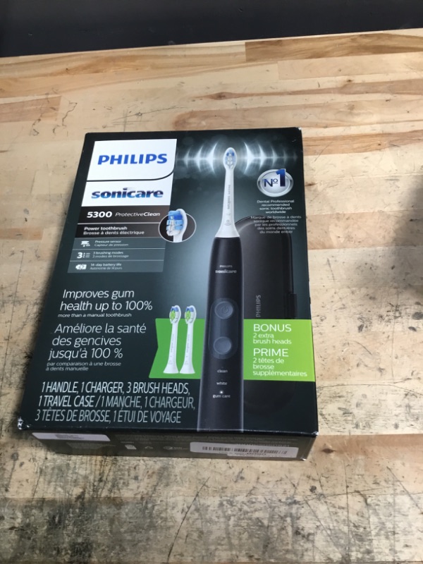 Photo 1 of **FACTORY SEALED** Philips Sonicare ProtectiveClean 5300 Rechargeable Electric Toothbrush, with Pressure Sensor, 3 Cleaning Modes, SmarTimer and QuadPacer, with 2 Bonus Brush Heads, Travel Case, Black, Model HX6423/34