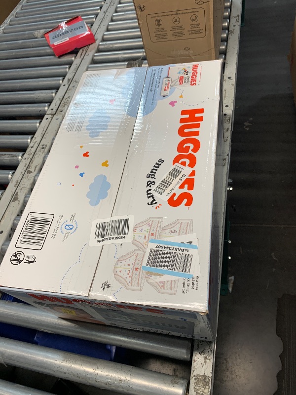 Photo 1 of ***FACTORY SEALED***Huggies Size 4 Diapers, Snug & Dry Baby Diapers, Size 4 (22-37 lbs), 150 Count, Packaging May Vary