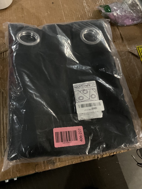 Photo 1 of (USED/FAIR) NICETOWN Halloween Pitch Black Solid Thermal Insulated Grommet Blackout Curtains/Drapes for Bedroom Window (2 Panels, 42 inches Wide by 63 inches Long, Black)