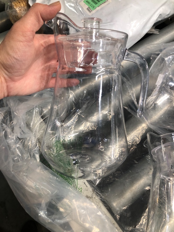 Photo 1 of ***(HEAVILY USED/ MINOR DAMAGE)***Didaey 4 Pcs Plastic Pitcher with Lid and Handle Clear Plastic Water Pitcher Shatter Proof Jugs for Drinks Fridge Iced Tea Juice Milk Lemonade Sangria Cold or Hot Beverages (68 oz)