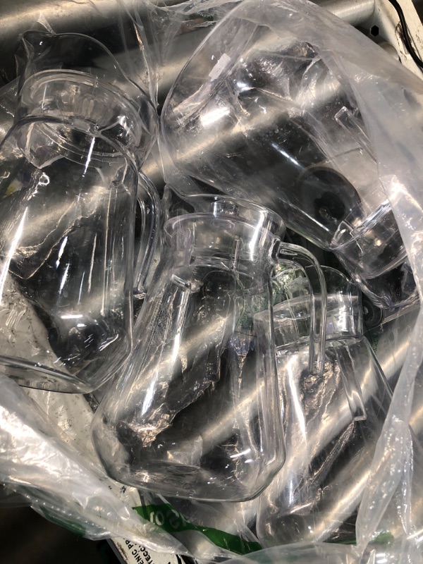 Photo 1 of ***(HEAVILY USED/ MINOR DAMAGE)***Didaey 4 Pcs Plastic Pitcher with Lid and Handle Clear Plastic Water Pitcher Shatter Proof Jugs for Drinks Fridge Iced Tea Juice Milk Lemonade Sangria Cold or Hot Beverages (68 oz)