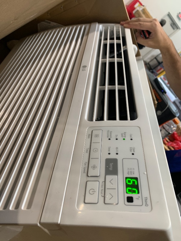 Photo 1 of ** VERY USED / TESTED FUNCTIONAL ** LG 12,000 BTU Smart Window Air Conditioner, 115V, AC Window Unit for Rooms up to 550 Sq. Ft., Perfect for Kitchen or Living Room, Phone & Voice Control, Works with LG ThinQ, Amazon Alexa, Hey Google