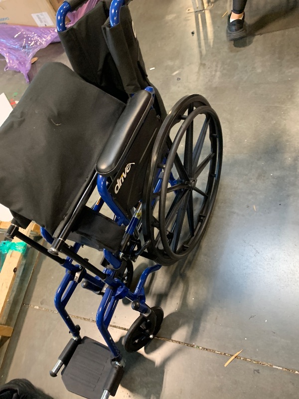 Photo 1 of ** USED / TESTED FUNCTIONAL ** Drive Medical Blue Streak Wheelchair with Flip Back Desk Arms, Swing Away Footrests,FoldingDesk Length Arms, Alloy Steel, 20 Inch Seat