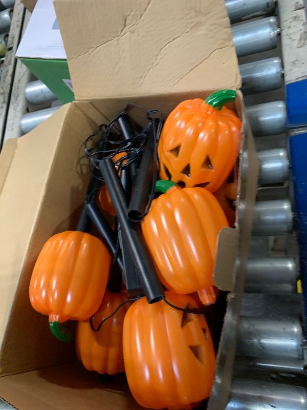 Photo 1 of *** STOCK PHOTO SIMILAR NOT EXACT *** Halloween Pumpkin Stake Lights, Set of 10 Decorative Solar Pumpkin Lights, Waterproof Halloween Decorations for Outdoor Garden and Yard