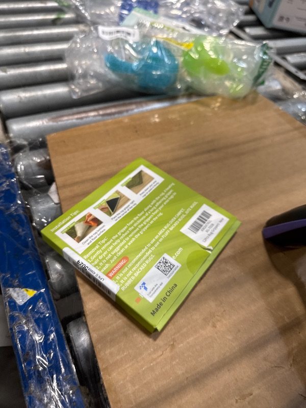 Photo 1 of **ONLY 4 PCS** Rabenda 12 Pcs Rug Tape, Non Slip Rug Pads Grippers for Hardwood Floors and Tiles, Reusable Carpet Tape for Area Rugs, Double-Sided Adhesive Rug Stickers Keep Corners Flat (Black)