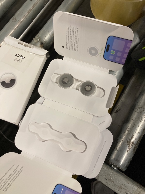 Photo 1 of **2 PIECES**Apple AirTag 4 Pack. Keep Track of and find Your Keys, Wallet, Luggage, Backpack, and More. Simple one-tap Set up with iPhone or iPad