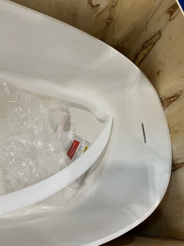 Photo 1 of ***MINOR DAMAGE ON RIM*** WOODBRIDGE 67 in. x 29.5 in. Stone Resin Luxury Contemporary Solid Surface Freestanding Bathtub in Matte White