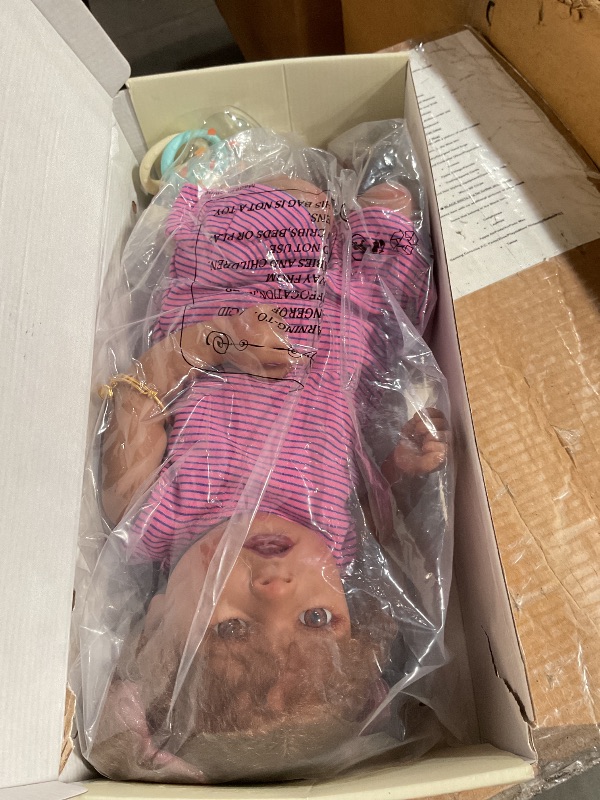 Photo 1 of ***(STOCK PHOTO FOR REFERENCE ONLY)***JIZHI Reborn Baby Dolls Black - 22 Inch Lifelike Soft Body Realistic-Newborn Baby Dolls Taupe Eyes Caramel Skin Tone Pink Striped Skirt Real Life and Toy Accessories Gift for Kids Age 3