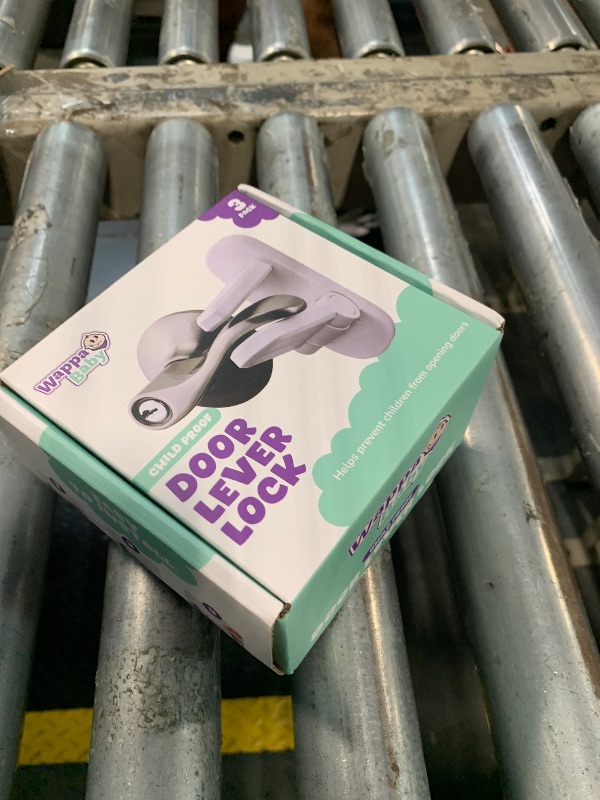 Photo 1 of **FACTORY SEALED** Door Lever Lock (3 Pack) Prevents Toddlers from Opening Doors. 3.25" L * 1.5" W * 4.5" H Easy One Hand Operation for Adults. Durable ABS with 3M Adhesive Backing. Simple Install, No Tools Needed.