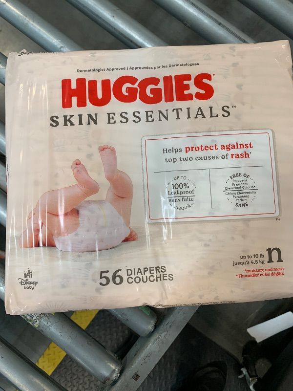 Photo 1 of **56 COUNT** Huggies Size Newborn Diapers, Skin Essentials Baby Diapers, Size Newborn (6-9 lbs), 56 Count, Packaging May Vary
