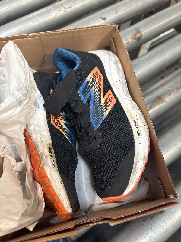 Photo 1 of **NEED TO BE CLEANED** New Balance Fresh Foam Arishi V4 Bungee Lace with Top Strap Running Shoe, Black/Blue Agate/Blaze Orange, 13.5 X-Wide US Unisex Little_Kid