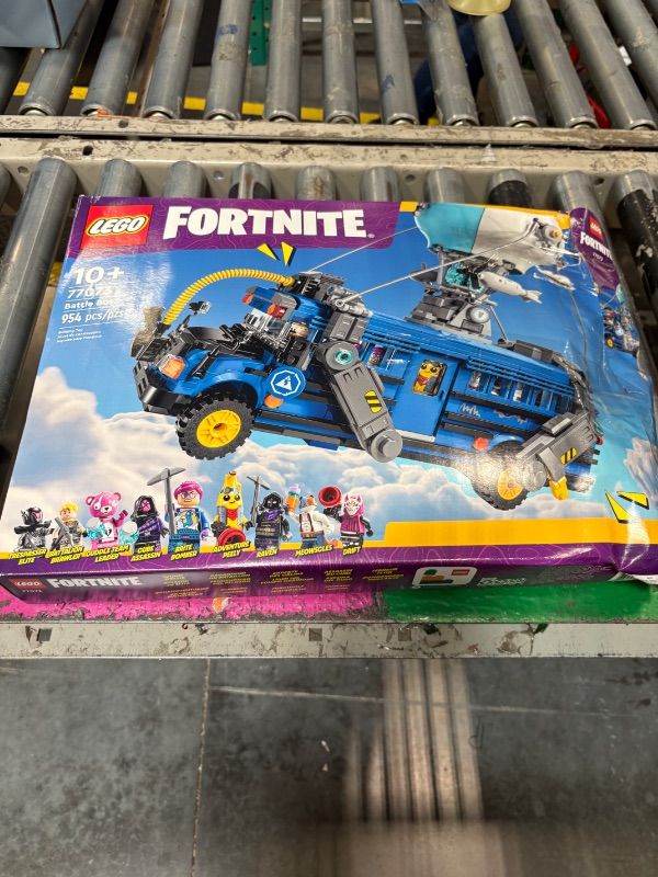 Photo 1 of **new but damaged box**LEGO Fortnite Battle Bus - Collectible Fortnite Toy for Kids, Boys and Girls, Ages 10+ - Pretend Play Set with 9 Minifigures from Video Game - Gift Ideas for Fans - 77073
