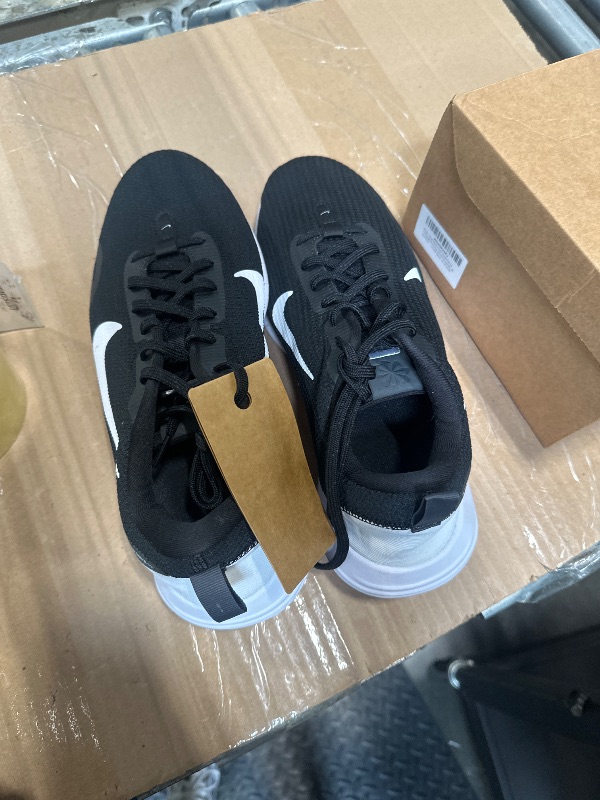 Photo 1 of **Dirty** Nike Men's Flex Experience Run 12 Sneaker, Black/White/Dark Smoke Grey, 10 X-Wide