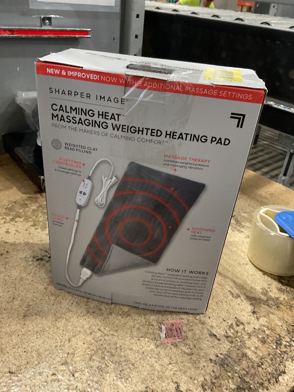Photo 1 of **POSSIBLY FOR PARTS** Calming Heat Massaging Weighted Heating Pad by Sharper Image- Weighted Electric Heating Pad with Massaging Vibrations, 9 Settings- 3 Heat, 6 Massage- 18 Relaxing Combinations, 12” x 24”, 4 lbs