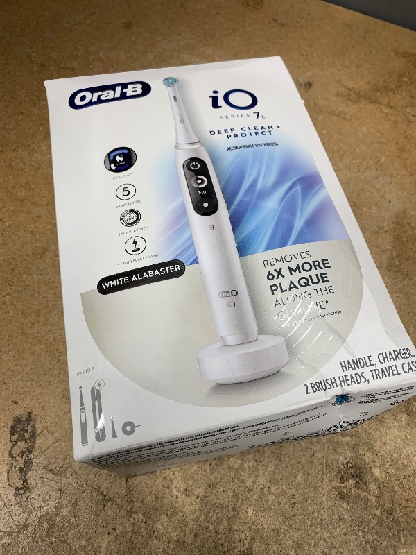Photo 1 of *MISSING PARTS* Oral-B iO Deep Clean + Protect Rechargeable Electric Toothbrush, White with a iO Series 7 Toothbrush, 2 Replacement Brush Heads, and a Charging Travel Case