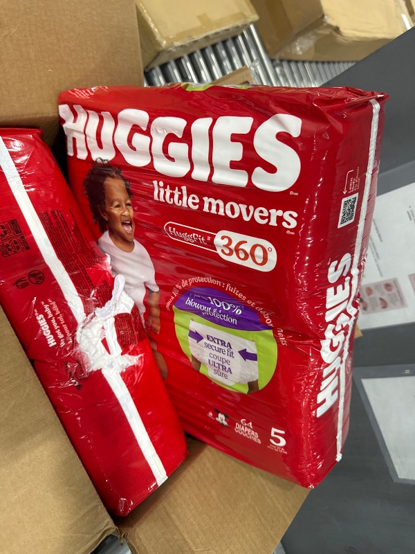 Photo 1 of One pack open**Huggies Size 5 Baby Diapers, Little Movers HuggFit 360° Baby Diapers with 360° Waistband, Size 5 (27+ lbs), 128 Count (2 Packs of 64), Packaging May Vary